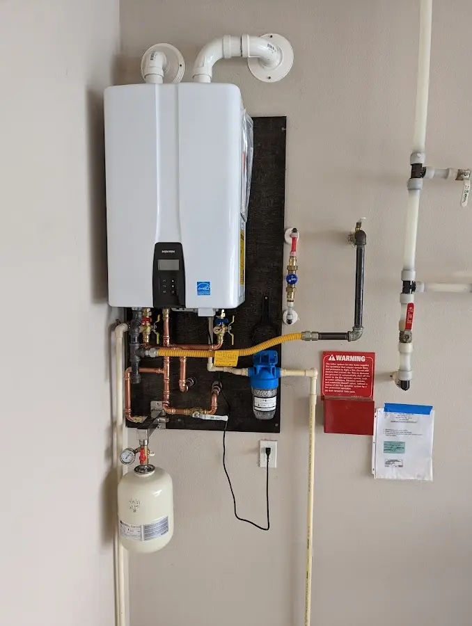 Professional plumber installing copper piping in a Temple City home